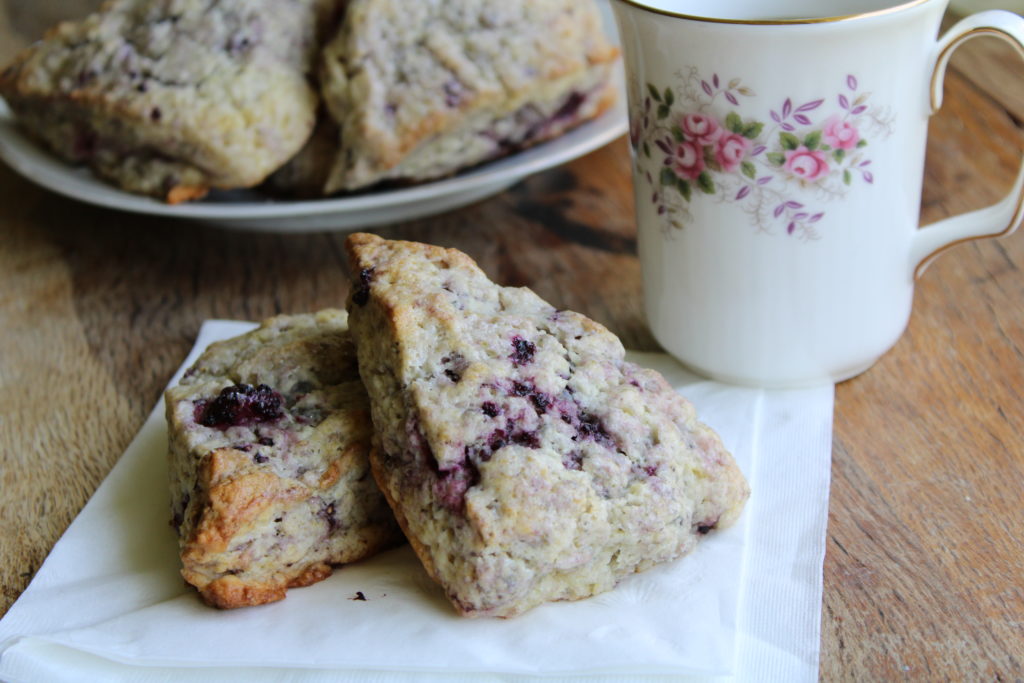 blackberry scones sitting on a white napkin