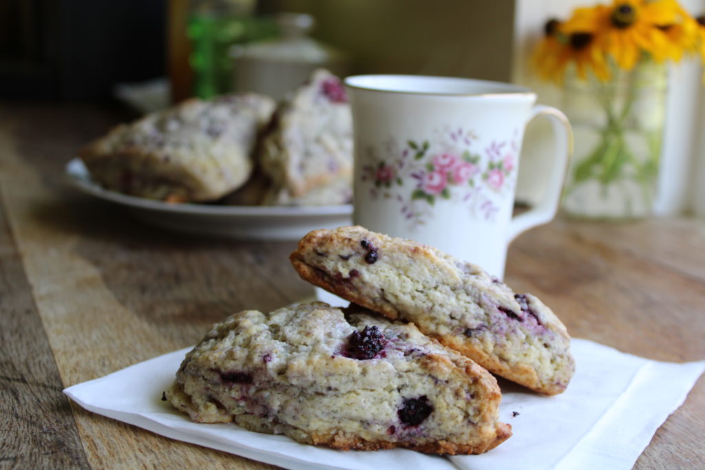 blackberry scones sitting on a white napkin