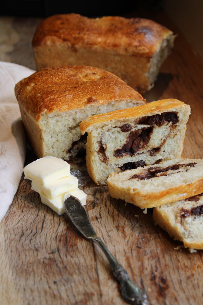 a loaf of cinnamon raisin bread made with sourdough discard