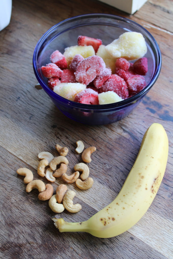 ingredients for homemade strawberry and pineapple popsicles