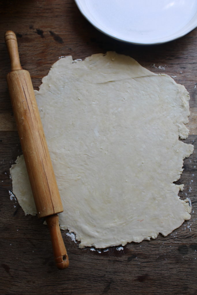 rolling out the flaky pie crust