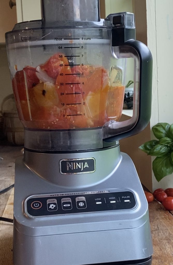 showing how to blend fresh roasted marinara sauce in food processor