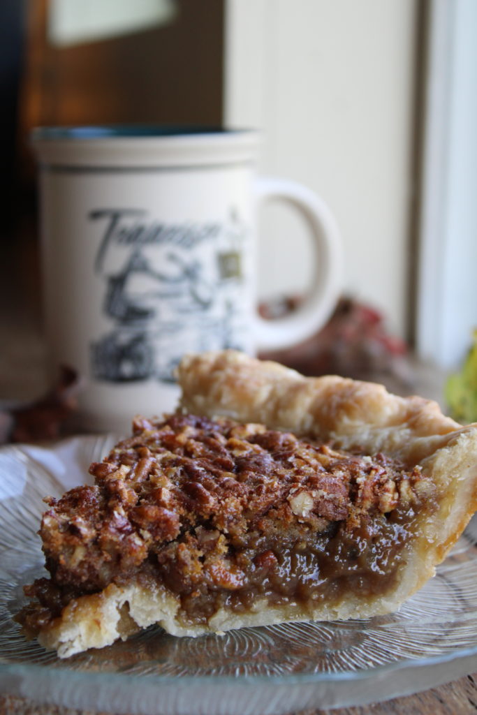 a slice of maple pecan pie on a plate